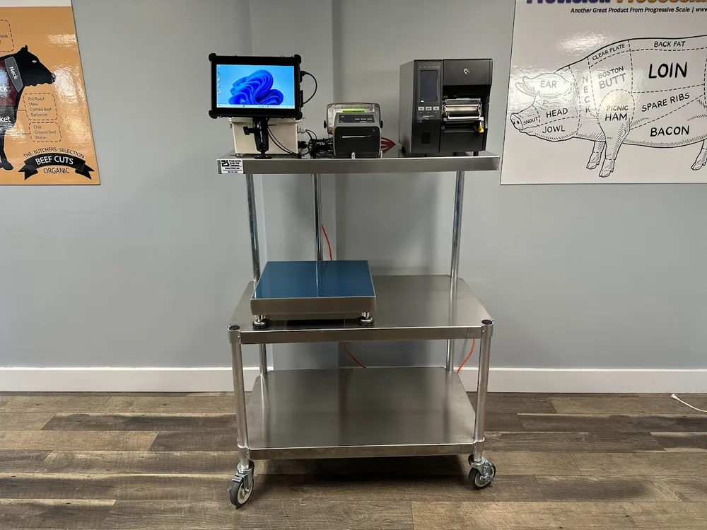 A stainless scale cart carrying a rugged tablet, Zebra industrial label printer, desktop printer and bench scale platform.